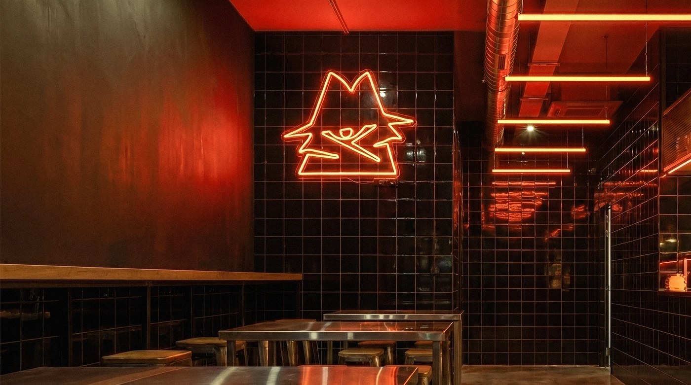 Physical spatial mockups showcasing the AFTERBITE burger identity on boxes