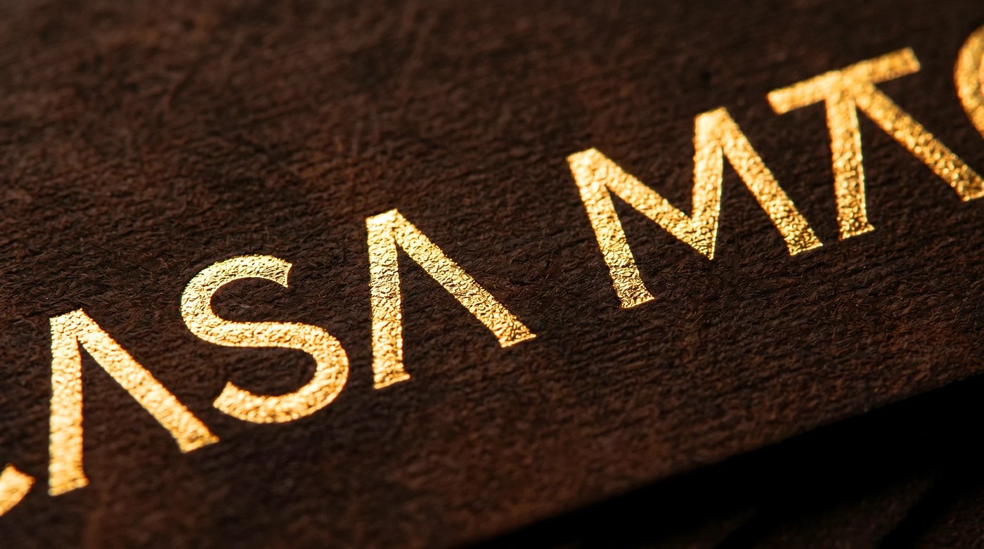 Mexican knife brand identity gold foil letterpress embossed into heavily textured dark brown cardstock