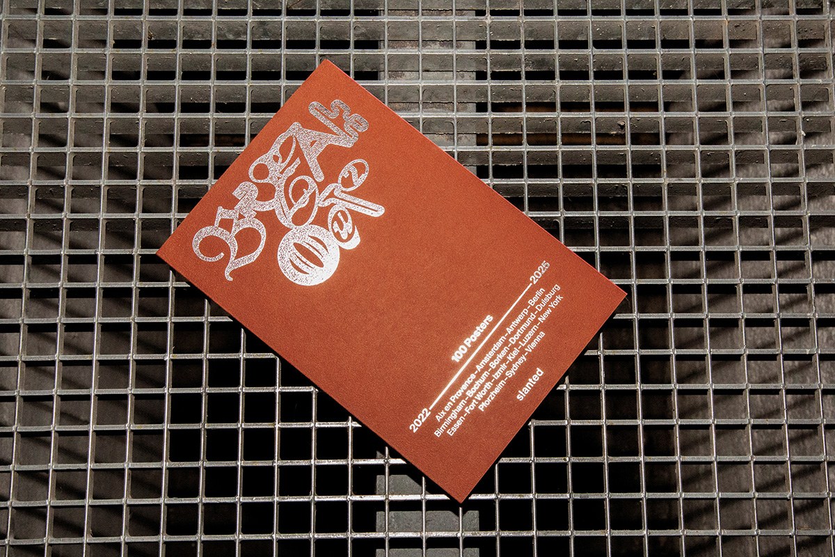 poster book design Breakout #2 cover with terracotta field and hot-foil embossed blackletter by Cihan Tamti