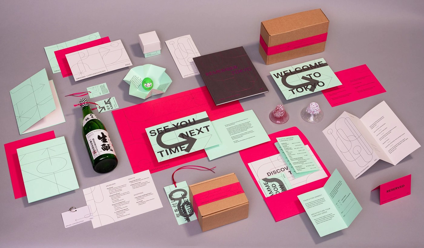 close-up of a foldable booklet showing layered geometric visual identity patterns
