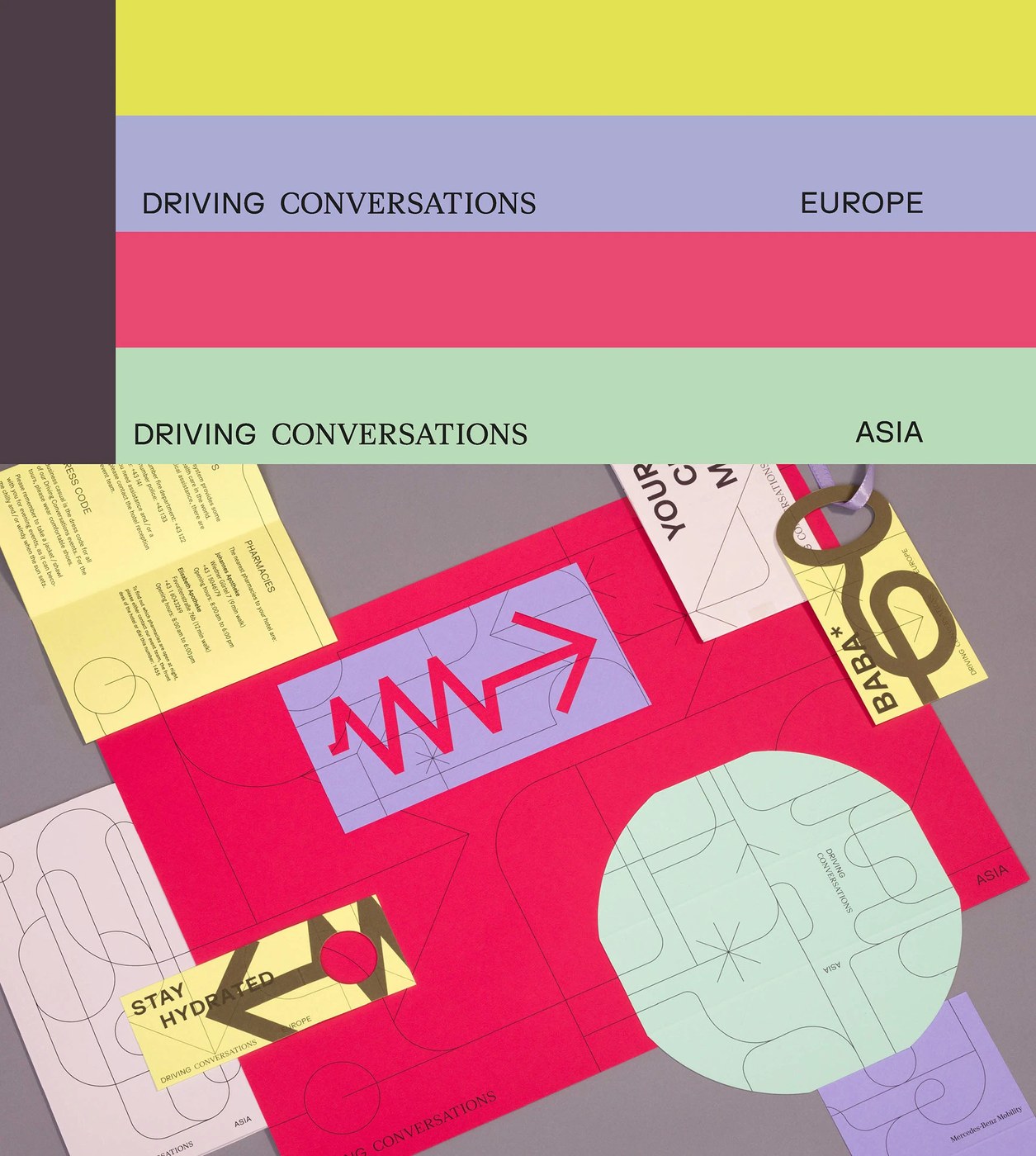 print documentation of a yellow booklet with intersecting black visual identity paths