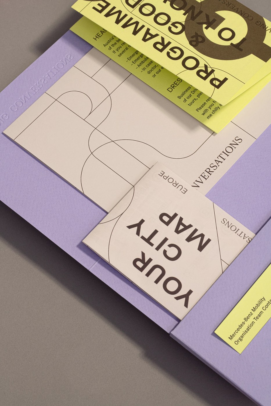 tactile design showing the texture of the paper and the visual identity fold patterns