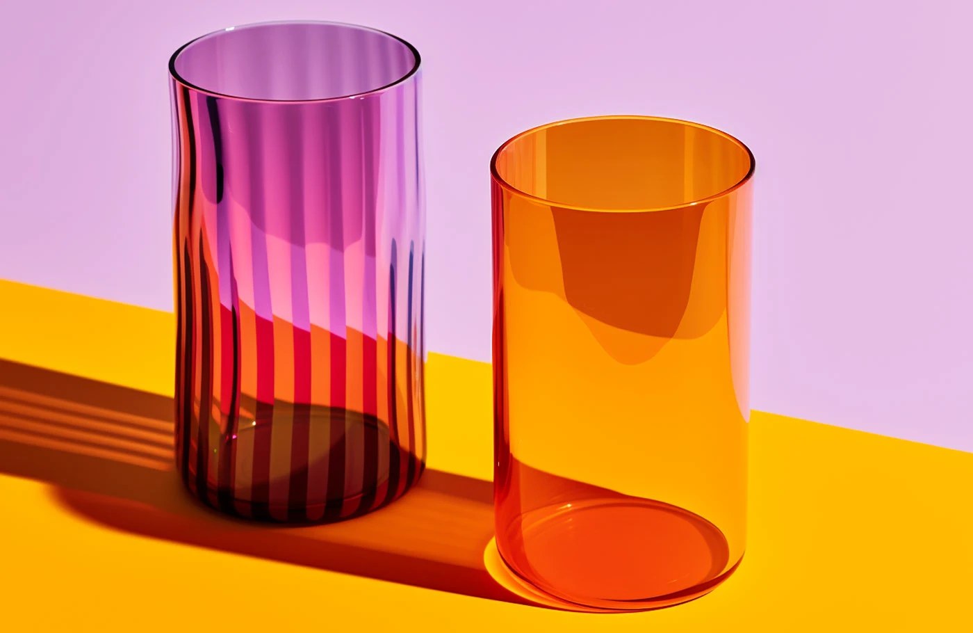Grandiose Collection glassware brand identity packaging — matte orange and olive cardboard boxes with black debossed logotype