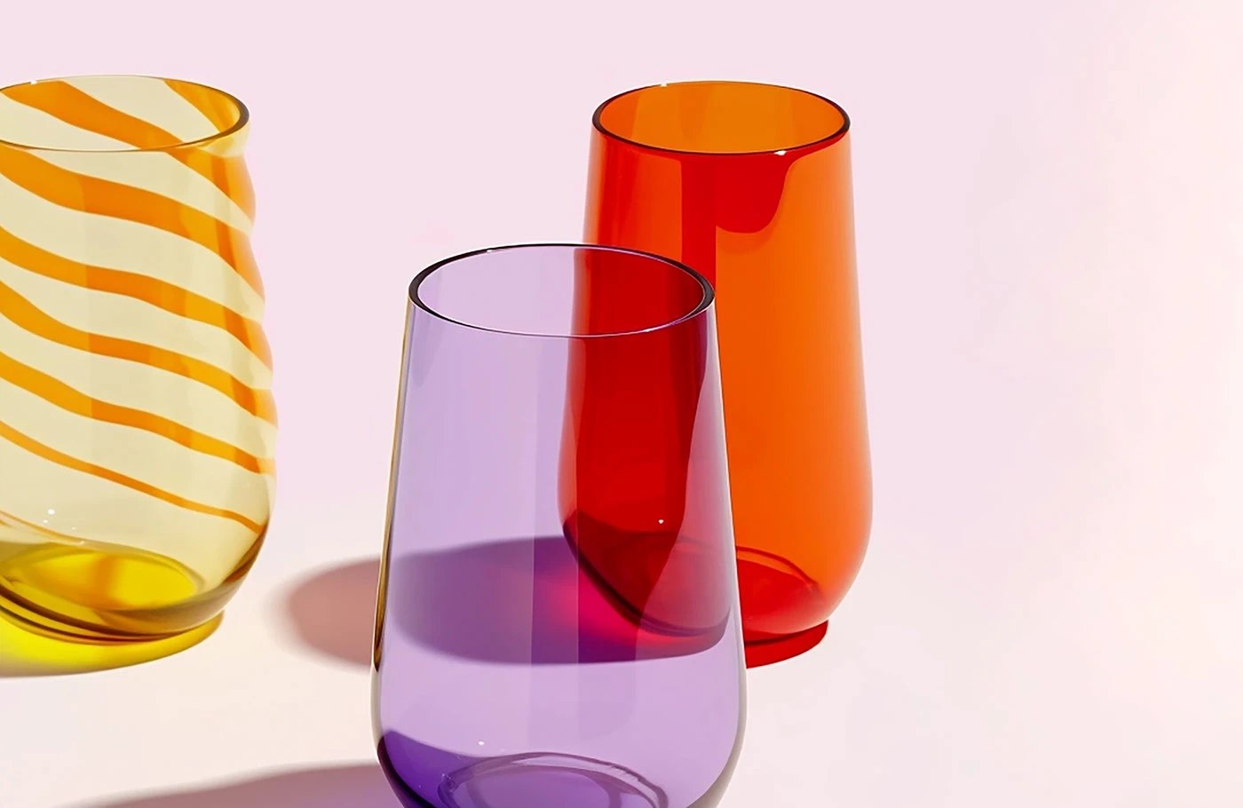 Grandiose Collection glassware brand identity editorial spread — condensed serif headline on solid orange ground