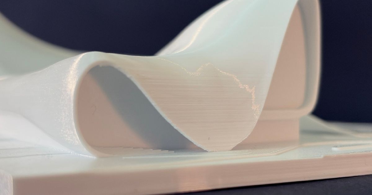 Heydar Aliyev Center 3D printed model side view showing parametric curves — graphic design by Adrian Martinez