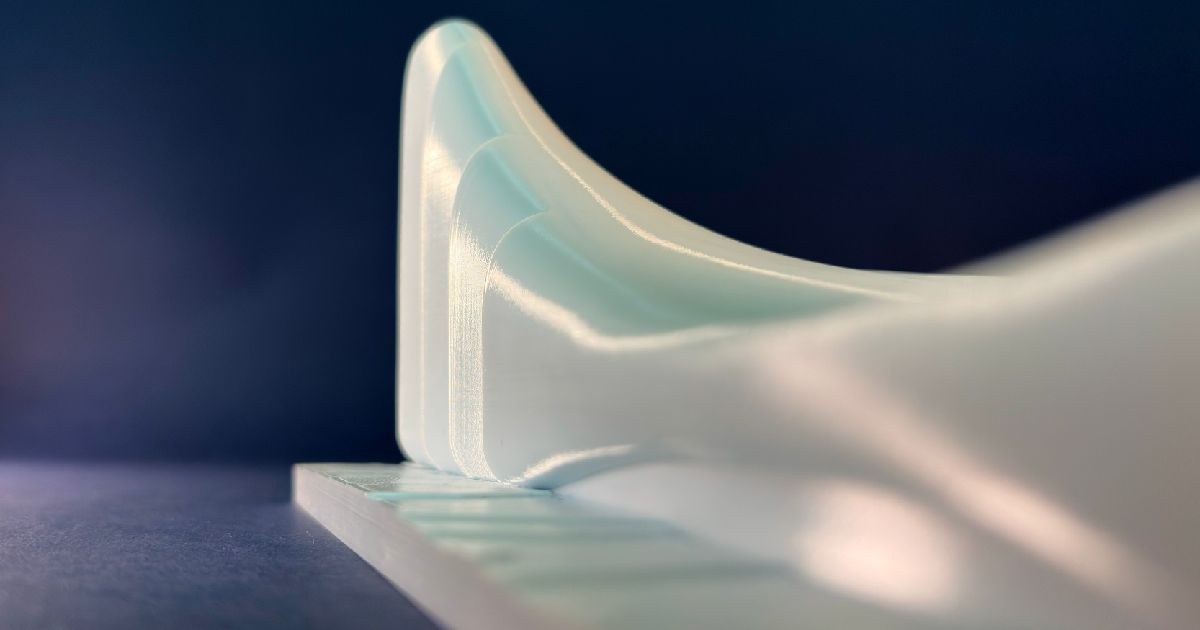 Rear view of Zaha Hadid's Heydar Aliyev Center scale replica model — graphic design by Adrian Martinez