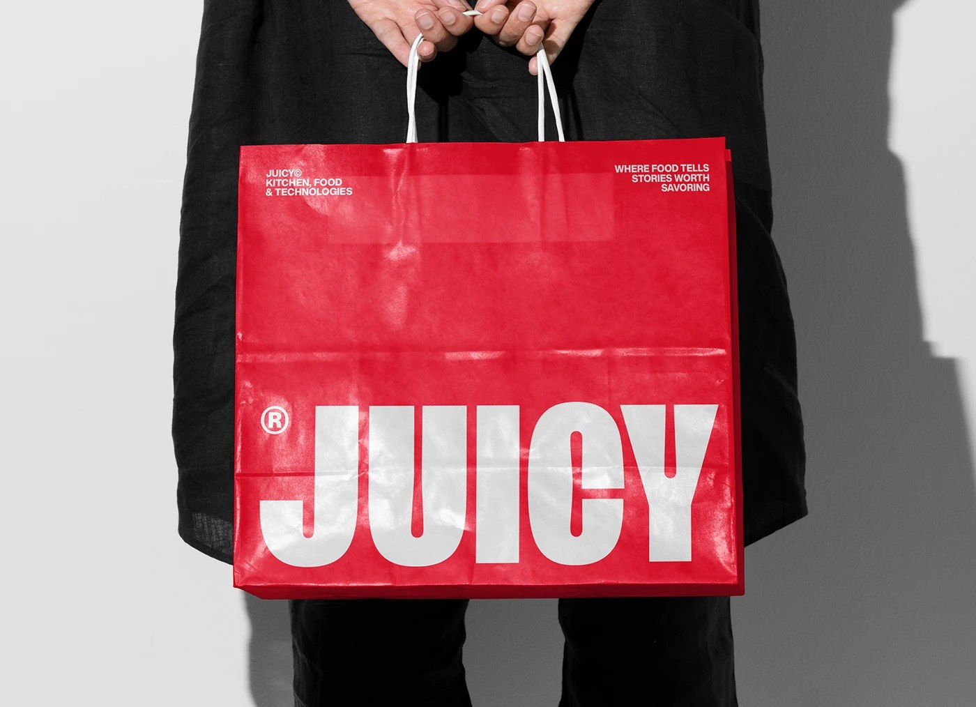 Juicy Foods food brand identity solid red shopping bag white condensed type bleeding to edges