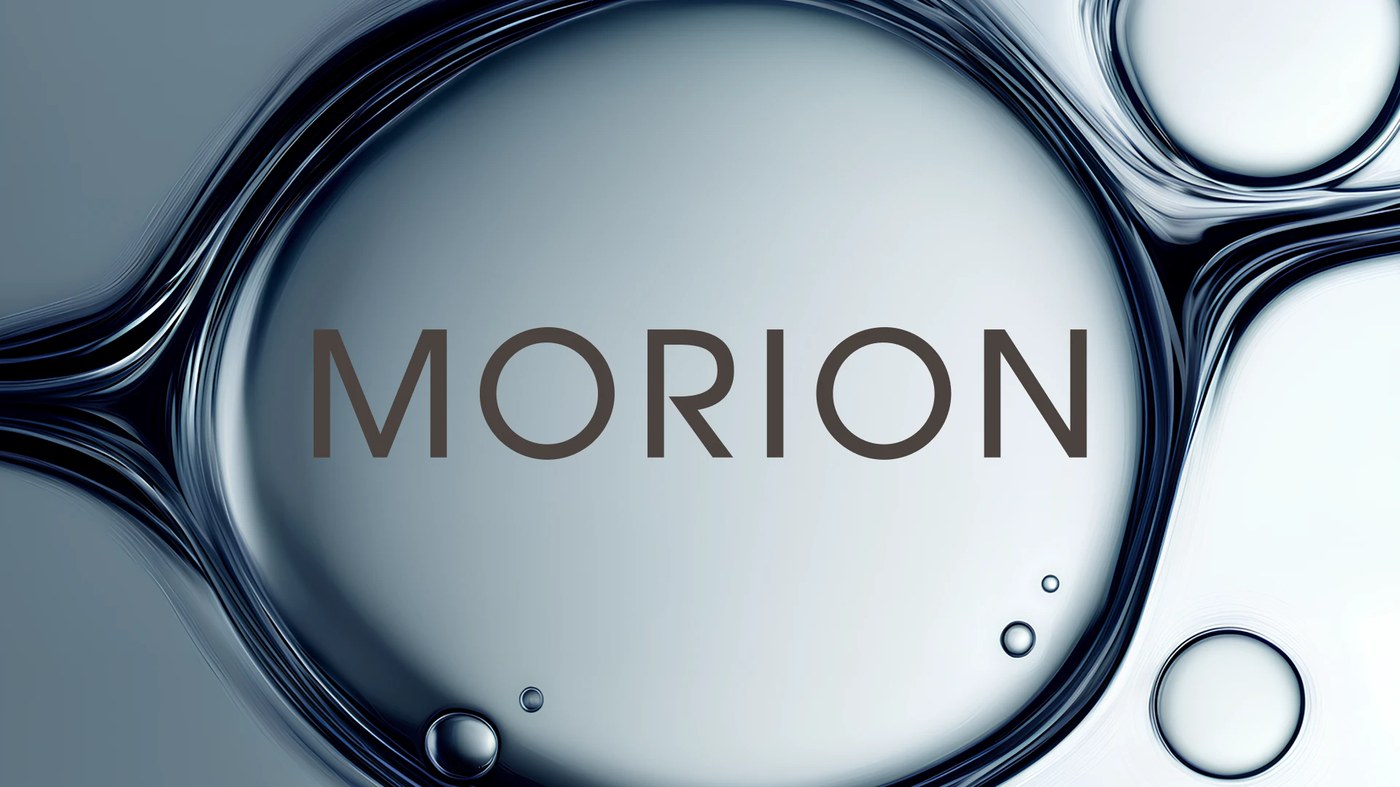 Cosmetics packaging design for MORION skincare, featuring clinical slate grey glass dropper bottles and cream tubs arranged in a clean studio setting.