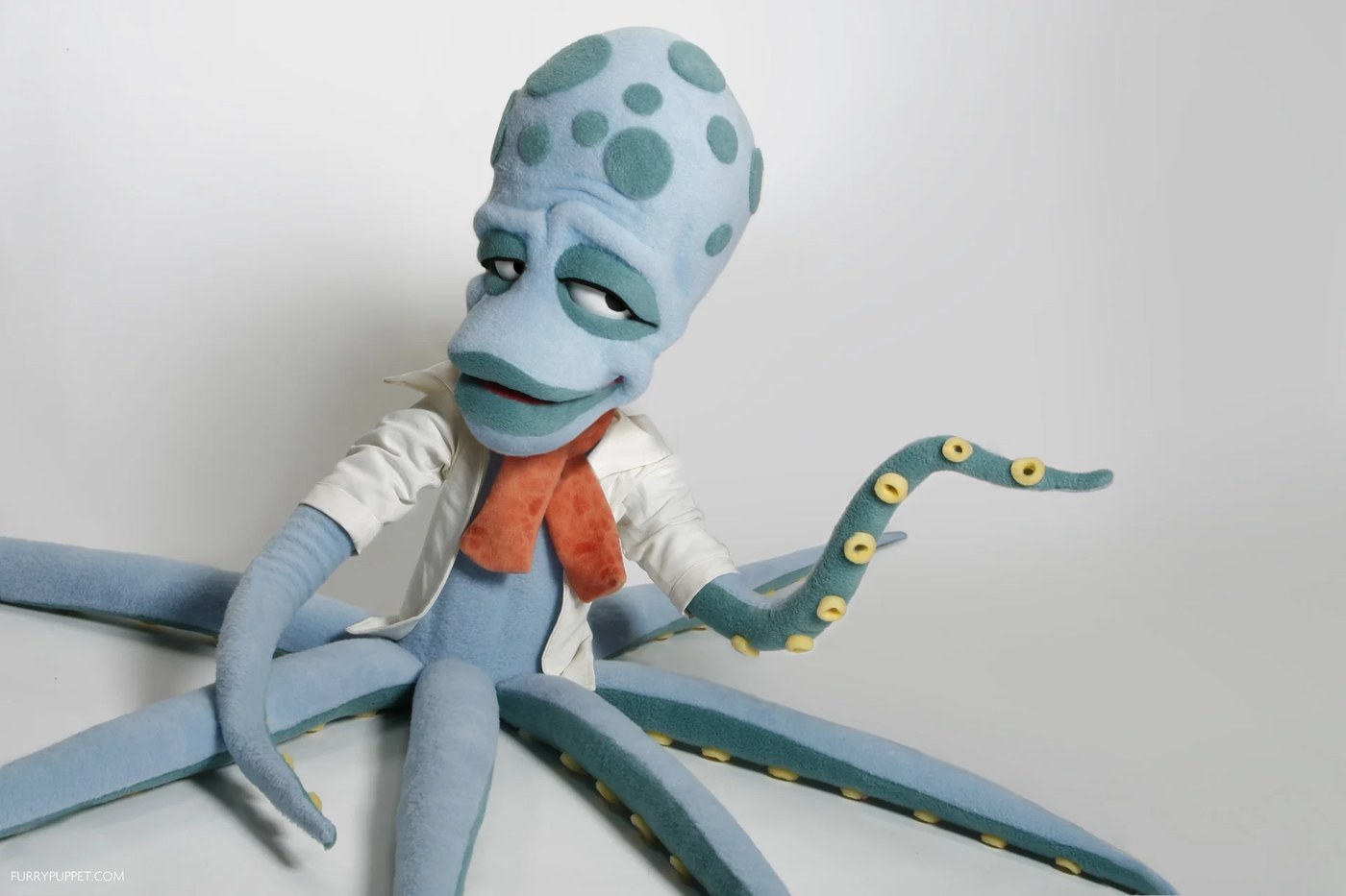 custom puppet design — smooth rubber octopus with articulated mechanical eyes by Furry Puppet Studio