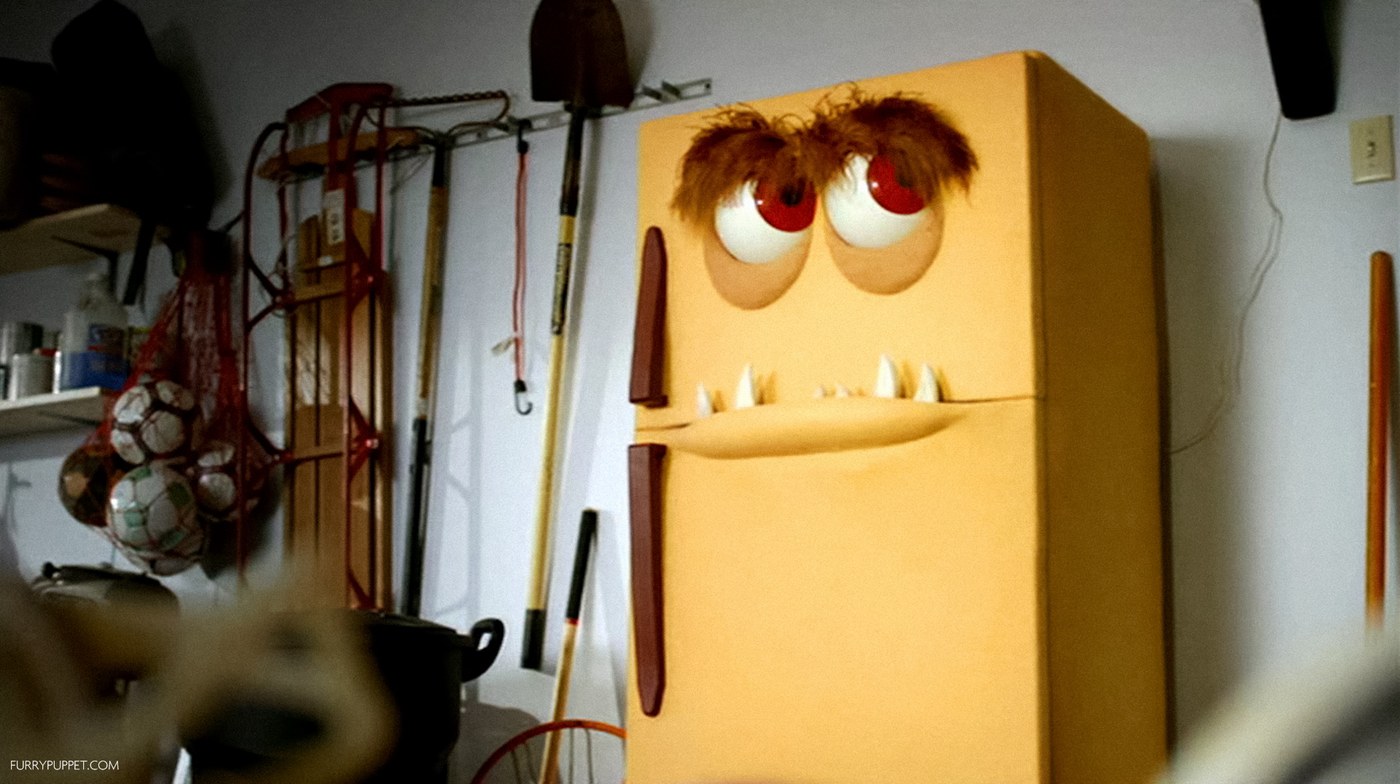 custom puppet design — full-scale talking refrigerator puppet with hinged moving eyelid hardware
