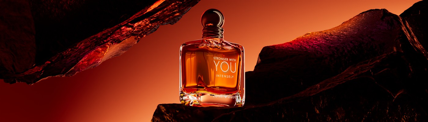 Perfume CGI hero render of the Stronger With You bottle in warm amber light