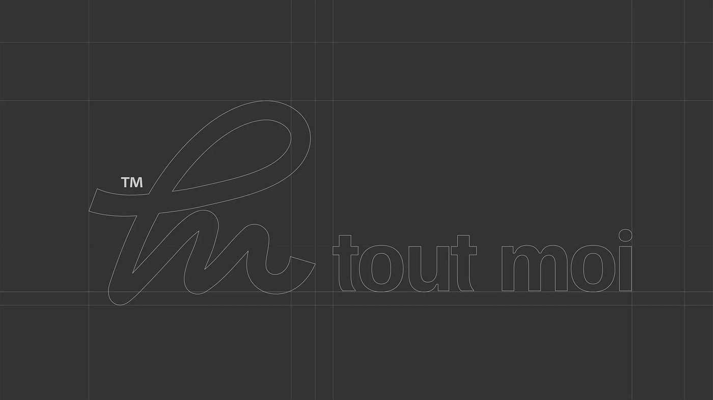real estate brand identity TM ligature construction grid on dark charcoal field