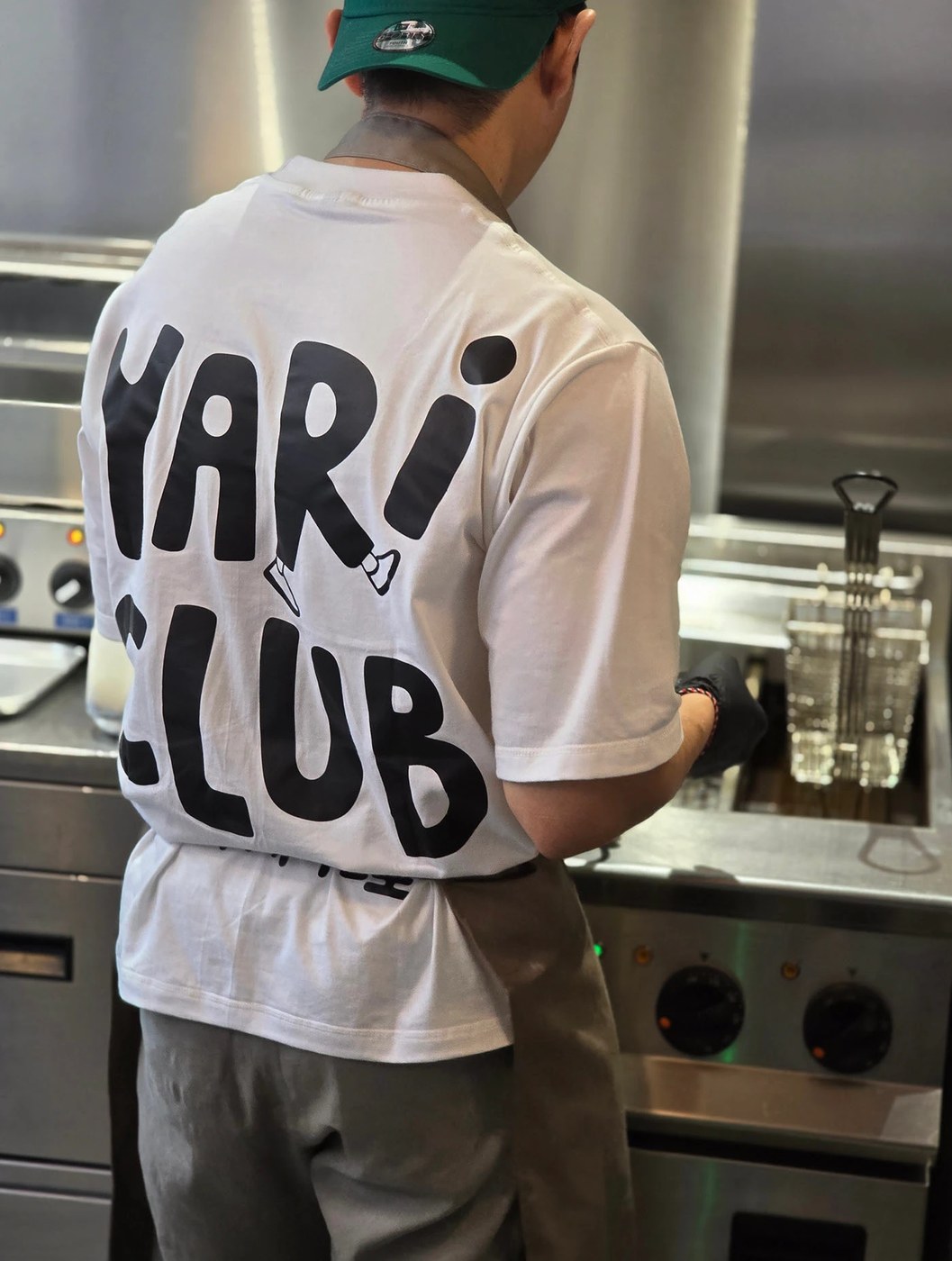 YARI CLUB restaurant brand identity textured wooden sign board outside the diner.